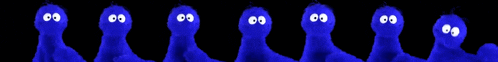 a group of blue ghosts with white eyes are standing in a row on a black background