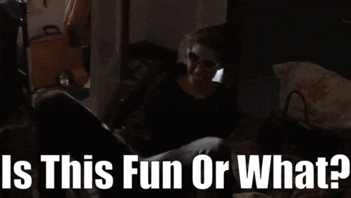 a person in a dark room with the words is this fun or what