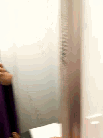 a close up of a person using a white tablet