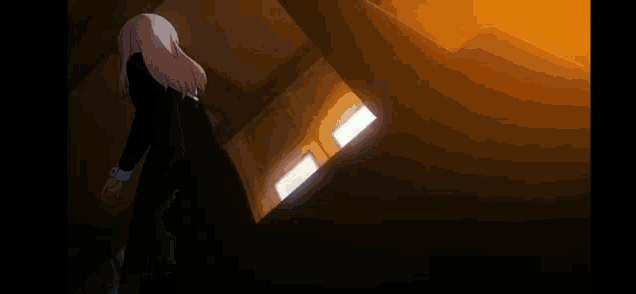 a person is walking in a dark room with a light coming out of their feet .
