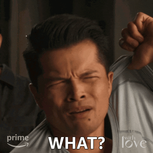 a man making a funny face with the word what written on his face