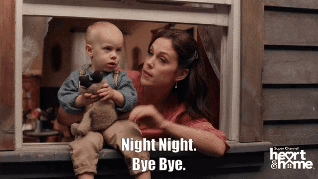a woman is holding a baby in her arms and says night night bye bye