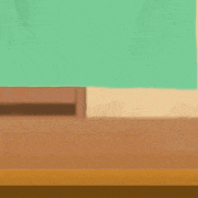 a cartoon character with a letter p on his hat is sitting on a wooden table .