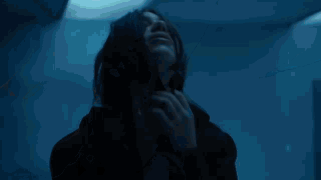 a close up of a person 's face with a blurred background