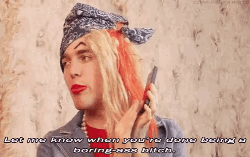 a man in a bandana talking on a cell phone