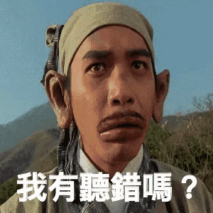 a man with a bandana on his head has a foreign language on his face