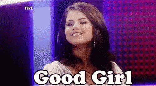 a woman is smiling and saying `` good girl '' on a stage .