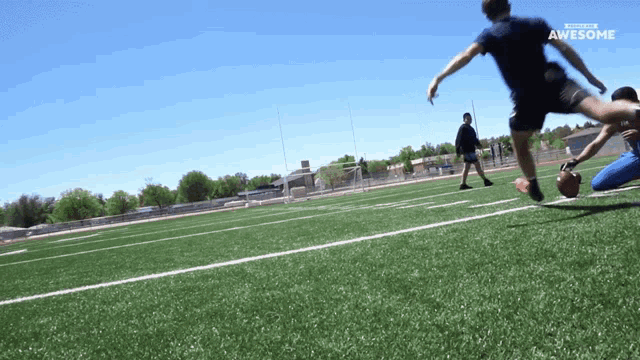 a football game is being played on a field that has the word awesome on it