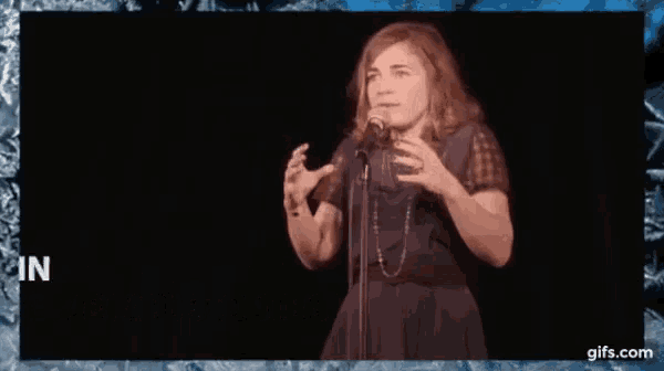 a woman singing into a microphone with the words " blanche gardin je parle toute seule " above her