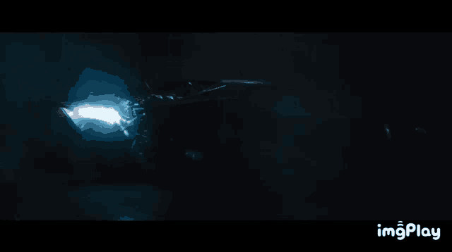 a close up of a person 's face with a light coming out of it