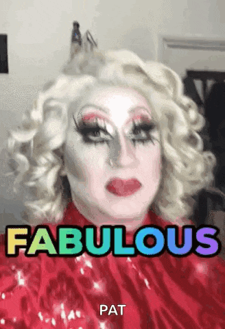 a drag queen is wearing a red dress and a wig and says fabulous pat .