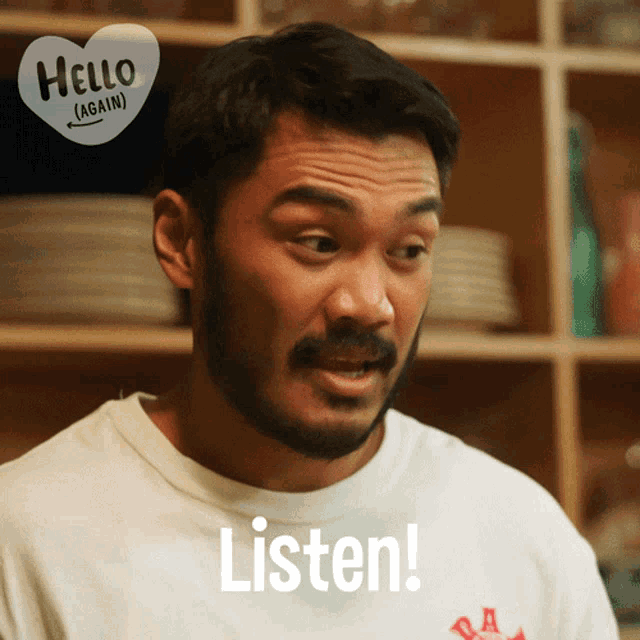 a man wearing a white shirt says listen