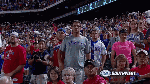 a crowd of people watching a texas rangers baseball game on fox southwest