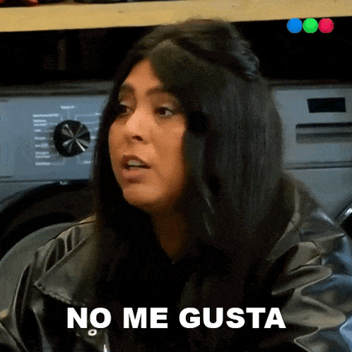 a woman says no me gusta in front of a laundry machine