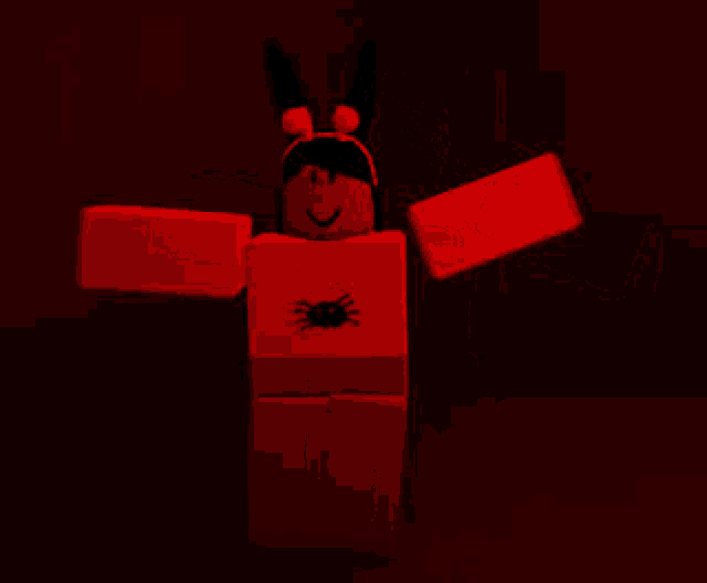 a red roblox character with a spider on his chest is standing in the dark .