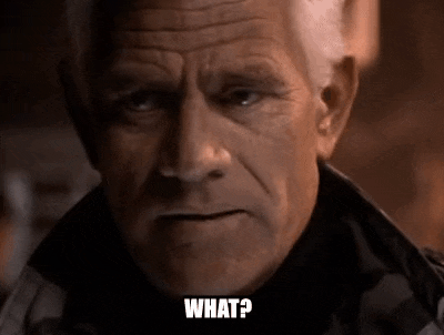 a close up of an older man 's face with the words `` what ? '' written on it .