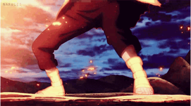 a person is standing on a rock with a fireball coming out of their feet .