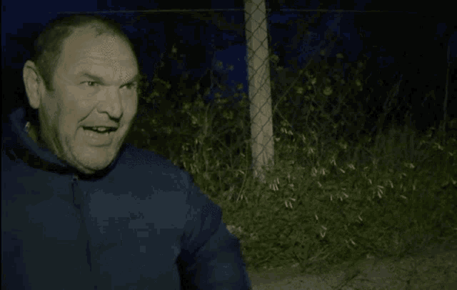 a man wearing a jacket that says columbia on the front