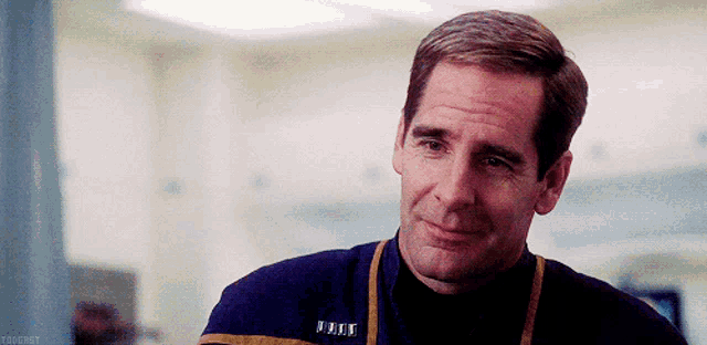 a man wearing a uniform with the letters u.n.t. on it