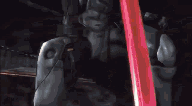a close up of a person holding a sword in a video game with flames coming out of it .
