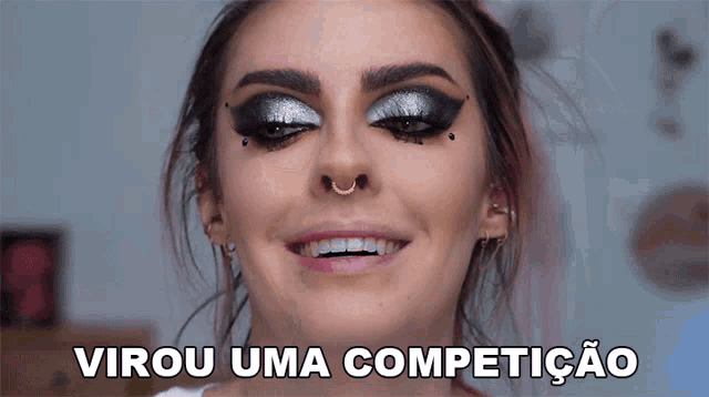 a close up of a woman 's face with the words virou uma competicao below her