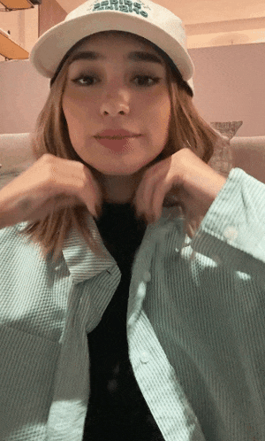 a woman wearing a white hat that says ' army ' on it