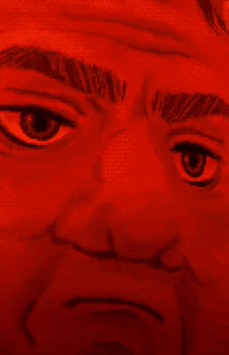 a close up of a man 's face in red light
