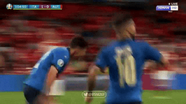 a soccer player with the number 10 on his back runs towards another player
