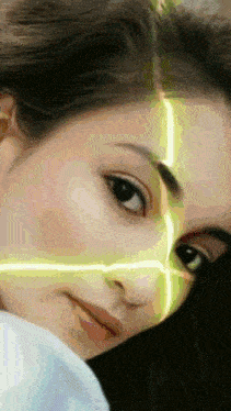 a close up of a woman 's face with a yellow line on her face