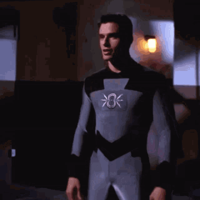 a man in a superhero costume with the number 8 on the chest