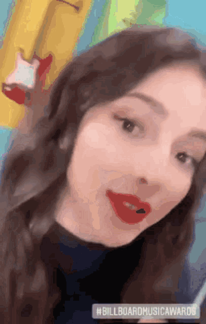 a close up of a woman 's face with the hashtag billboardmusicawards