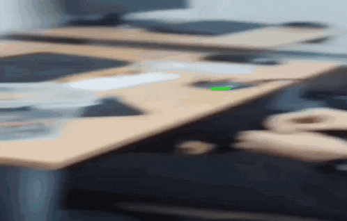 a person is sitting at a desk in front of a computer .