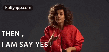 a woman in a red jacket is making a funny face and saying `` then , i am say yes '' .