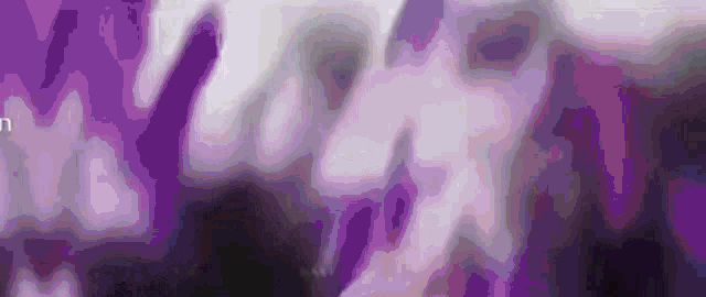 a blurry picture of a crowd of people dancing at a party
