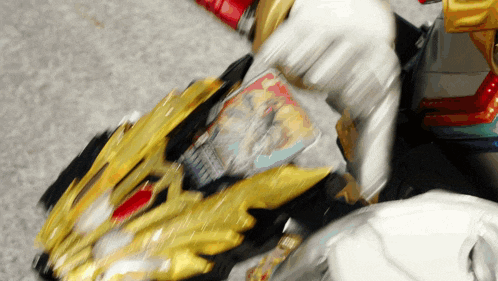 a person is playing with a toy that has a magazine in it