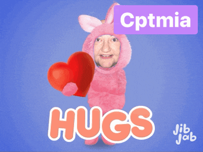 a man in a pink bunny costume is holding a red heart with the words hugs behind him