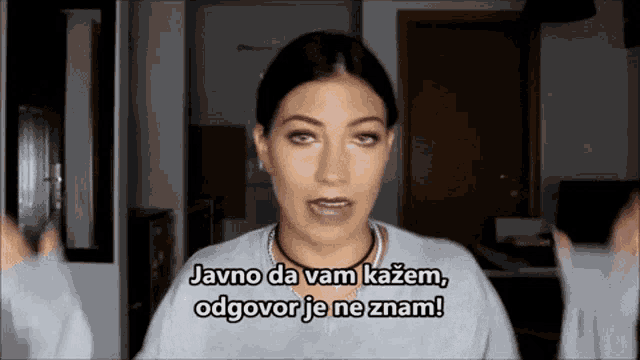a woman is making a funny face and says " javno da vam kazem "