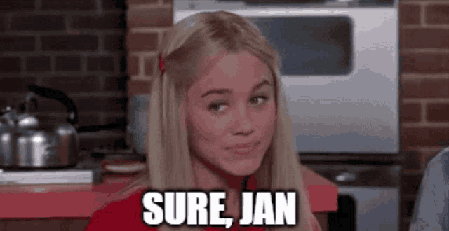 a woman in a kitchen with the words sure jan above her