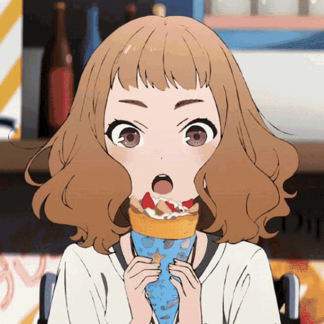 a girl with a surprised look on her face is eating a crepe with a starfish on it