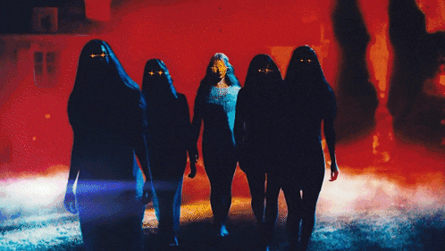 a group of women are walking in the dark with welc written on the bottom