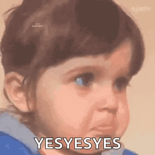 a baby girl is making a funny face and saying yes yes yes .
