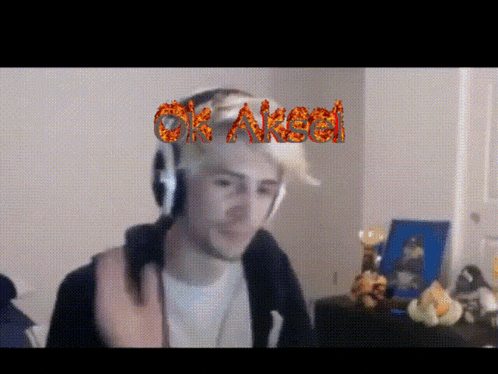 a man wearing headphones says ok aksel in red