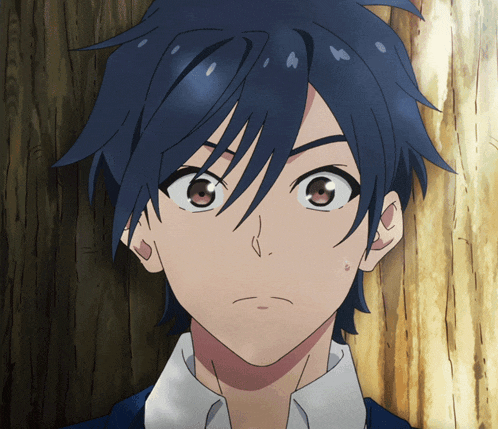 a close up of a boy 's face with blue hair and brown eyes