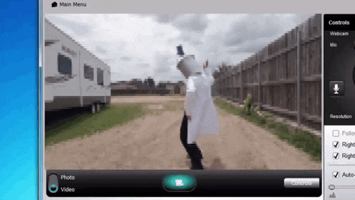 a computer screen shows a man dancing in front of a trailer and the main menu