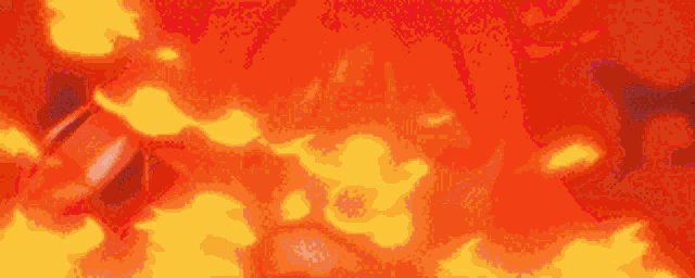 a close up of a red and yellow background with a lot of fire coming out of it .