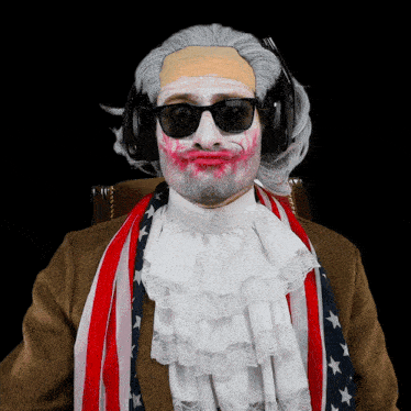 a man with white paint on his face is wearing headphones and an american flag scarf around his neck