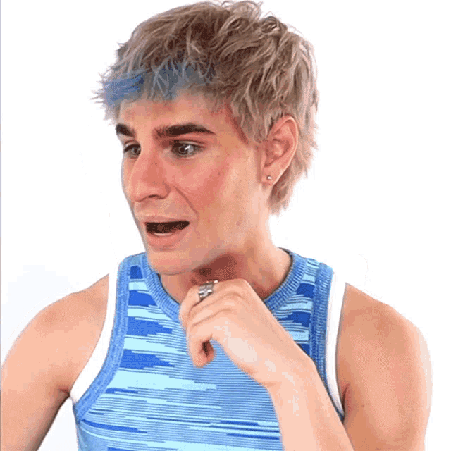 a man with blue hair and a blue tank top