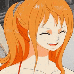 a close up of a woman 's face with orange hair