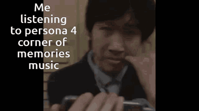 a man wearing headphones is crying while listening to persona 4