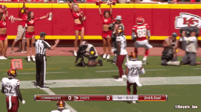 a football game between the commanders and the chiefs is being played